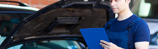 Mechanic doing an MOT test - MOT Colne